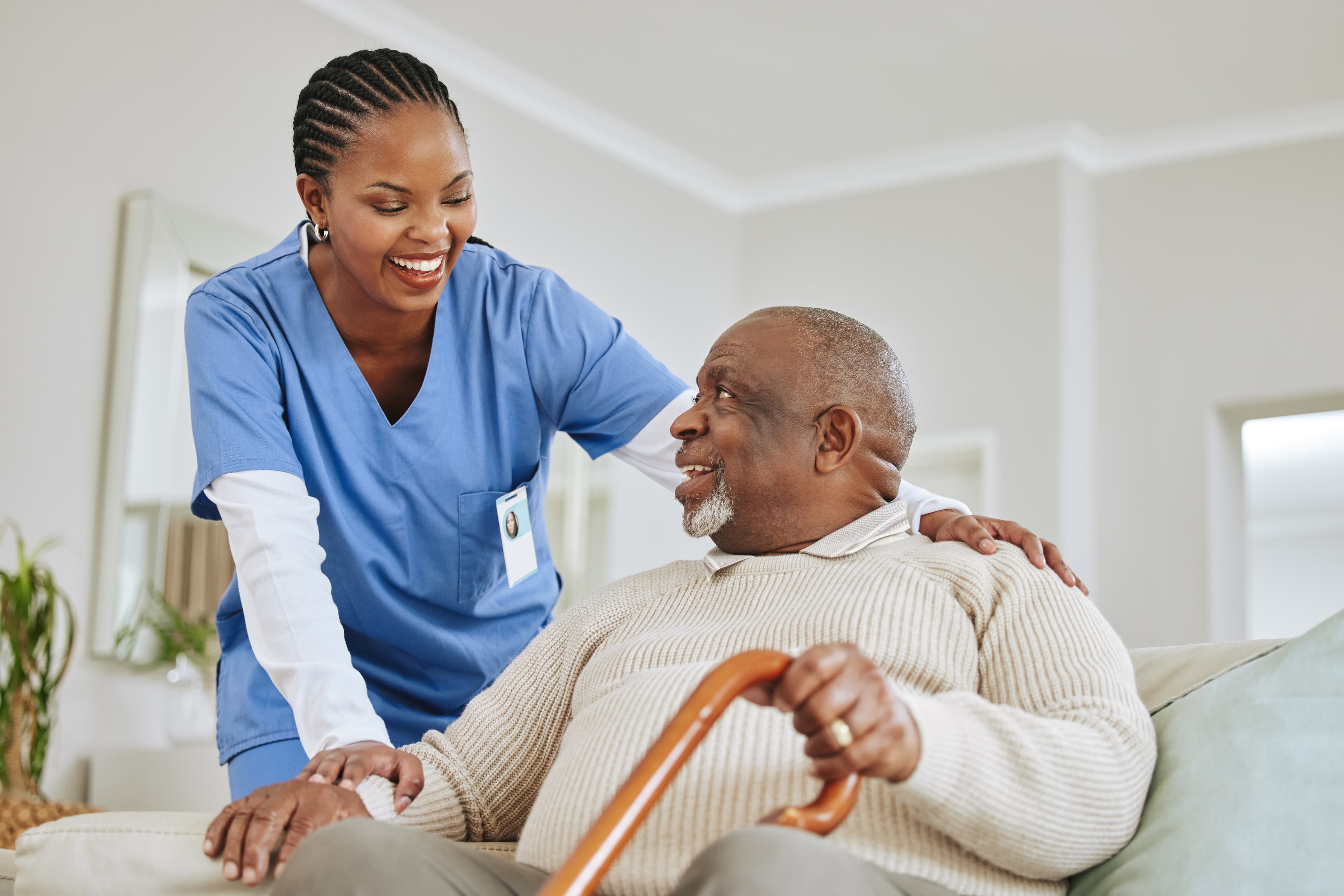 Carer helping a client at home